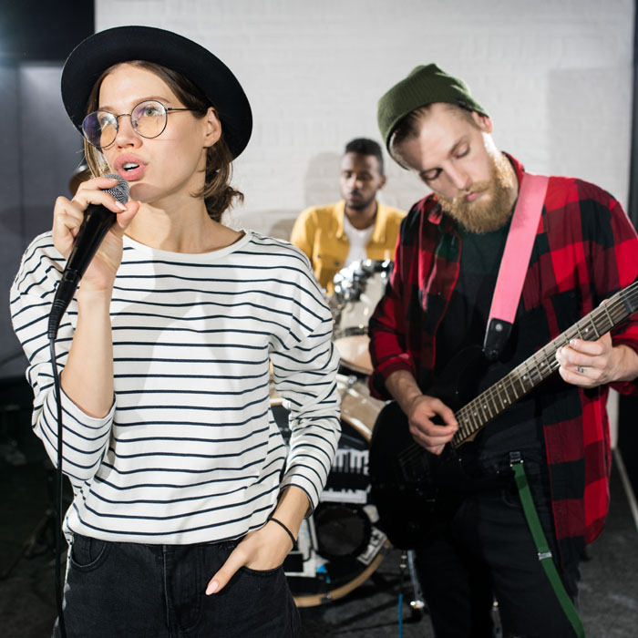Live band playing music in recording session